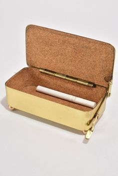 an open suitcase with a pen in it