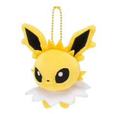 a pokemon stuffed animal hanging from a chain