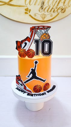 a basketball themed birthday cake with the number 10 on it