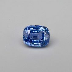 a blue diamond sitting on top of a table