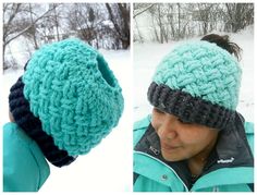 a woman wearing a knitted beanie hat in the snow and looking at it