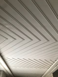 the ceiling is white and has lines painted on it