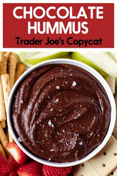 chocolate hummus in a bowl with strawberries and crackers