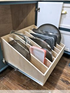 an open drawer with several pairs of shoes in it and the words diy pull - out sloted storage drawer