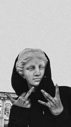 black and white photograph of a woman with her hands in the shape of a v