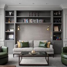 a living room filled with lots of furniture and bookshelves in it's walls