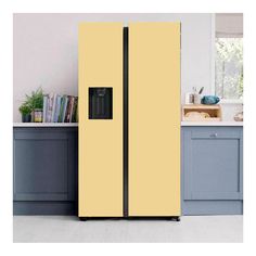 a yellow refrigerator freezer sitting inside of a kitchen