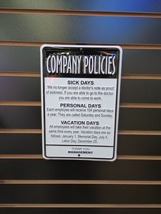 a sign on the side of a building stating that it is important for employees to stay at work