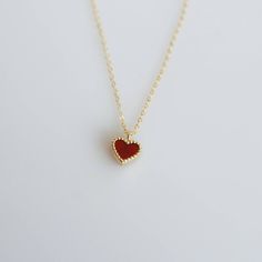 Tiny and dainty red agate heart filled with love and passion, such a perfect present for Valentine's Day and your loved ones. :: Style name: RDHRT-ENLN1034 :: Heart size: 7x7.5mm :: Material: 14k solid yellow gold :: Stone type: red agate Notes :: Jewelries are measured in millimeters and centimeters. :: Please read store policy before placing order. :: In stock items are ready to ship in 3 business days, made to order items are ready to ship in 2-4 weeks. :: International Shipping AVAILABLE. :: Red Heart Cut Jewelry For Mother's Day, Minimalist Red Heart-shaped Jewelry, Red Heart Charm Fine Jewelry, Red Heart-shaped Jewelry For Mother's Day, Red Fine Jewelry With Heart Charm, Red Open Heart Jewelry For Mother's Day, Red 14k Gold Heart Cut Jewelry, Red 14k Gold Jewelry For Valentine's Day, 14k Gold Heart Cut Red Jewelry