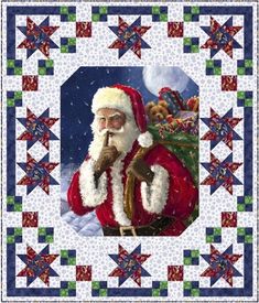 a santa clause quilted on top of a blue and white wall hanging from a wooden frame