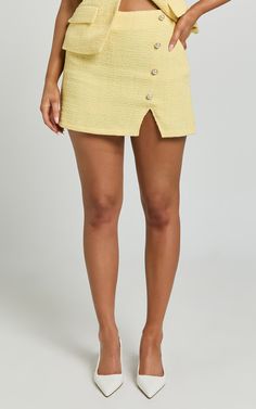 Elevate your style with our stunning Mika Skort - a true blend of chic sophistication and playful charm! Crafted from luxurious boucle in an eye-catching lemon hue, this faux wrap skort brings a burst of sunshine to any ensemble. Designed for the fashion-forward woman, the Mika Skort seamlessly combines the comfort of shorts with the elegant appeal of a skirt, making it a versatile staple for every wardrobe. Product Details: Zips feature Inner lining Skort Shorts Boucle fabric Polyester material Skirt Making, Red Sequin Dress, Basic Black Dress, Wrap Skort, Bachelorette Dress, Navy Bridesmaid Dresses, Long Sleeve Dress Formal, White Long Sleeve Dress, Summer Capsule Wardrobe