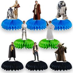 star wars figurines are displayed on top of paper fanned decorations, including r2d2 and c3po