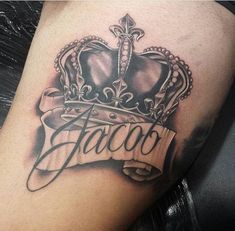 a black and white photo of a tattoo with a crown on it