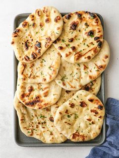 flat bread pita breads on a baking pan