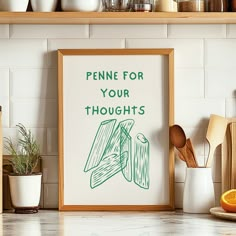 a framed poster that says penne for your thoughts on the wall above a kitchen counter