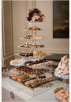 a table topped with lots of different types of pastries