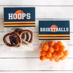 two bags filled with pretzels and basketballs next to each other on a table