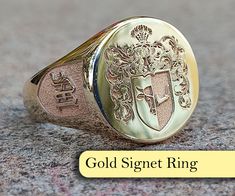 "At our store, we offer a range of exquisite \"Family Crest Ring\" and \"Coat of Arms Ring\" options that are fully customizable to capture the unique identity and history of your family. Family crests and coats of arms have been an essential part of family tradition for centuries, symbolizing the lineage and cultural significance of a family.  Our rings are meticulously crafted by skilled artisans, featuring your family crest or coat of arms engraved on a stunning gold or silver band, and adorned with a variety of precious stones such as emeralds, rubies, sapphires, onyx, aquamarine, and lapis. Our rings are not only a remarkable family heirloom, but also make a meaningful and sentimental gift for both men and women. We take pride in offering customization options that allow you to create Mu Logo, Wax Seal Ring, Family Crest Ring, Family Crest Rings, Custom Signet Ring, Family Crests, Ring Plate, Seal Ring, Family Family