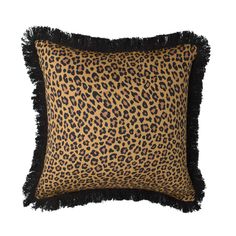 a leopard print pillow with fringe trim