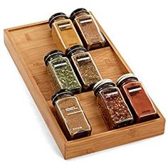 spice rack with spices in it on a white background