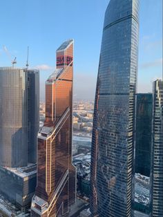 an aerial view of some very tall buildings