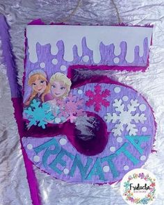 a frozen princess birthday cake with the number five on it