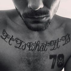 a shirtless man with his name tattooed on his chest and the number 78 written in cursive writing