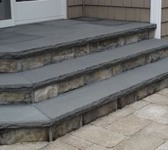 a set of stone steps leading up to a door