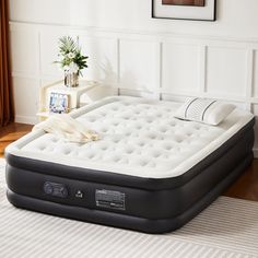 an inflatable mattress is sitting on the floor