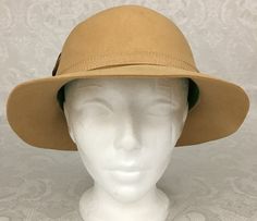 "Here we have a vintage Lord & Taylor 100% wool Adolfo II Beige Cloche Hat with feather millinery. The circumference is 21 1/2\". The Brim ranges from 1 3/4\" - 2 1/2\". I see no problems with this lovely Hat. I try my best to give accurate descriptions, although I am no expert, plus I'm human and sometimes I might miss a flaw. I always provide high resolution photos and consider them to be part of the description. I encourage you to zoom in and examine them closely as they show exactly what Vintage Wool Brown Hat Bands, Vintage Wool Brimmed Hat, Vintage Brown Wool Hat Bands, Vintage Beige Felt Hat With Flat Brim, Vintage Wool Hat Bands For Winter, Adjustable Vintage Wool Hat Band, Vintage Beige Fedora Felt Hat, Vintage Wool Hat Bands With Flat Brim, Vintage Wool Cloche Hat With Curved Brim