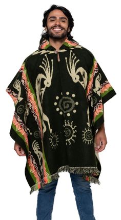 a man wearing a black poncho with an animal design on the front and side