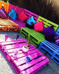 colorful wooden pallets are arranged on the ground