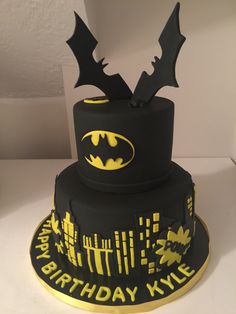 a batman themed birthday cake on a table