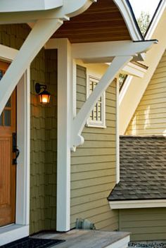 the front door of a house with an attached porch