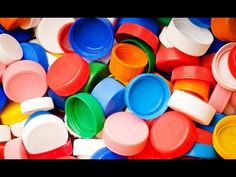 many different colored plastic cups and lids