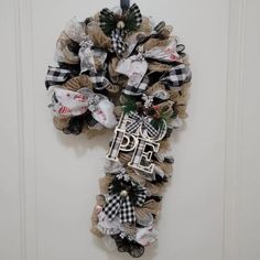 a wreath with the word hope hanging on it