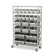 a large metal shelf with many bins on it's sides and two wheels