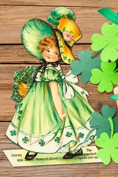 a st patrick's day card with a girl in green