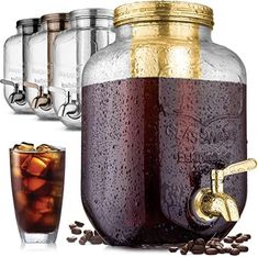 three mason jars filled with liquid and ice next to a glass full of coffee beans