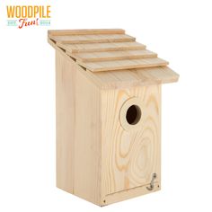 a birdhouse made out of wood with a hole in the top and bottom section