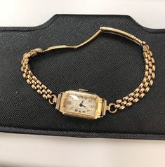 "A Fine Vintage Ladies watch  6 Jewels , 2 adjustment  Gold filled bracelet.  Art Deco 1920s  Winds and sets well and timekeeping Good.  Oiled & Serviced  Cosmetic condition: 90% new (minty )  Case size 20-24mm including winding button. note : For vintage and antique timepiece for  more than 50 years ,  there no way can guarantee the accuracy as like quartz watches, we will check before shipment for 12 hours, make sure the watch is running as described, if it's not working well, we will cancel your order before ship out and we don't accept return. ^^ Why Vintage/ Antique jewelry & watches? 🌹Timeless Elegance:  offering a blend of vintage charm and functional sophistication. 🌹The unique and enduring appeal of owning a piece of history & heritage at your fingertips 🌹Each jewelry piece is Cheap Vintage Formal Watch, Vintage Diamond Watch With Rectangular Dial For Formal Events, Vintage Diamond Watch With Rectangular Dial For Formal Occasions, Vintage Yellow Gold Diamond Watch With Jubilee Bracelet, Vintage Watch With Rectangular Dial, Vintage Yellow Gold Watch With Jubilee Bracelet, Vintage Yellow Gold Self-winding Watch Accessories, Vintage Diamond Watch With 17 Jewels And Round Dial, Vintage Adjustable Rectangular Watch Bands