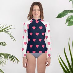 Get a colorful and soft rash guard that's the right fit for any active teen who loves water and contact sports. Its longer body and sleeves will protect the skin, while the fitted design means it won't get in the way even during the most intense activities. * 82% polyester, 18% spandex * 6.78 oz/yd² (230g/m weight may vary by 5% * UPF 50+ * Very soft four-way stretch fabric that stretches and recovers on the cross and lengthwise grains * Fitted design * Comfortable longer body and sleeves * Overlock, flat seam, and cover stitch * Blank product components sourced from China Sporty Long Sleeve Rash Guard With Uv Protection, Sporty Long Sleeve Rash Guard For Water Sports, White Stretch Rash Guard With Upf 50+, White Stretch Rash Guard Upf 50+, Casual Rash Guard With Uv Protection For Playwear, Playful Long Sleeve Rash Guard With Uv Protection, Playful White Rash Guard For Summer, Playful White Summer Rash Guard, Sporty Rash Guard With Uv Protection For Water Sports