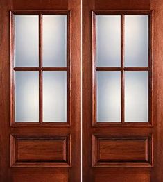 an open wooden double door with glass panels on the top and bottom panel, in front of a white background