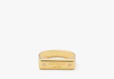 a gold plated ring with an inscription on it