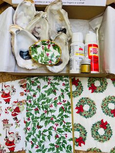 an open box with christmas themed napkins and other items in it, including oysters