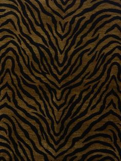 an animal print pattern is shown in brown and black