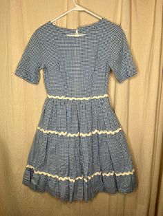 This dress is in great condition with no stains, tears, or holes. If you have any questions please feel free to ask. Flat Lay Measurements: Chest: 17 inches Shoulder: 15 inches Waist: 12 inches Hip: 21 inches Length: 35 inches Fitted Gingham Retro Vintage Dress, Fitted Gingham Vintage Dress, Retro Fitted Gingham Vintage Dress, Fitted Vintage Gingham Dress In Retro Style, Retro Gingham Vintage Dress, Retro Cotton Plaid Dress For Picnic, Vintage Fitted Plaid Dress For Picnic, Retro Short Sleeve Plaid Gingham Dress, Fitted Vintage Plaid Dress For Picnic