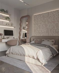 a bedroom with a bed, desk and mirror in the corner is lit by recessed lights