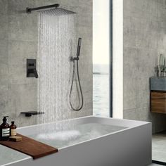 a bathroom with a bathtub and shower head