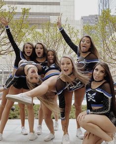 a group of cheerleaders posing for a photo